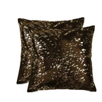 Two brown patterned pillows on a white background