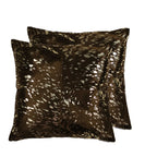 Two brown decorative pillows with a speckled pattern on a white background