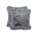 Two gray fluffy pillows on a white background