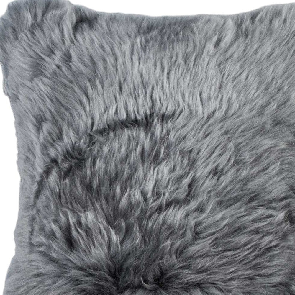 Gray fluffy pillow with a soft texture