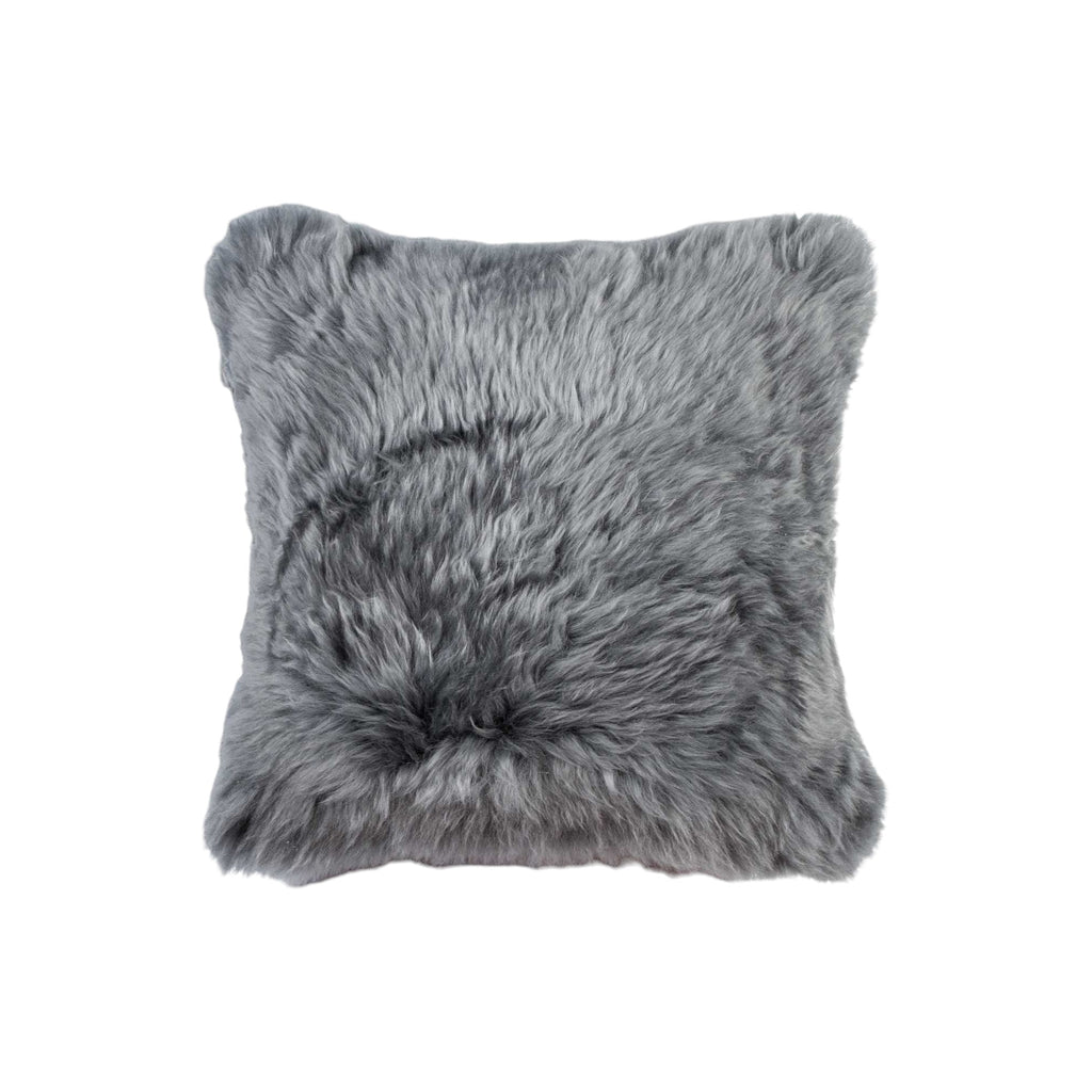 Gray faux fur pillow on a white background