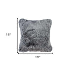 Gray faux fur pillow with dimensions on a white background