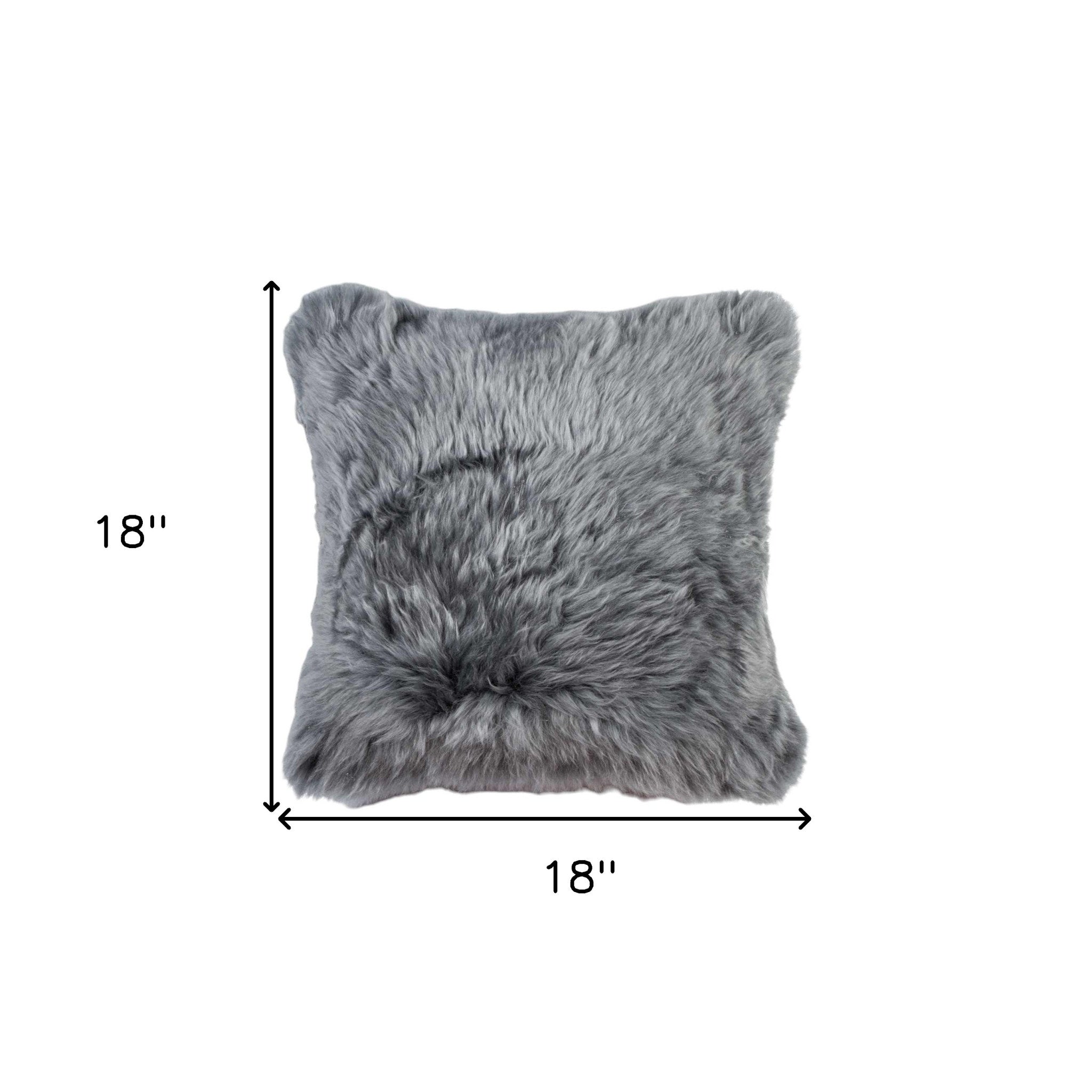 Gray faux fur pillow with dimensions on a white background