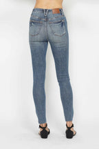 Judy Blue Tummy Control Vintage Wash Distressed Hem Jeans - Whispering Desires Shoppe